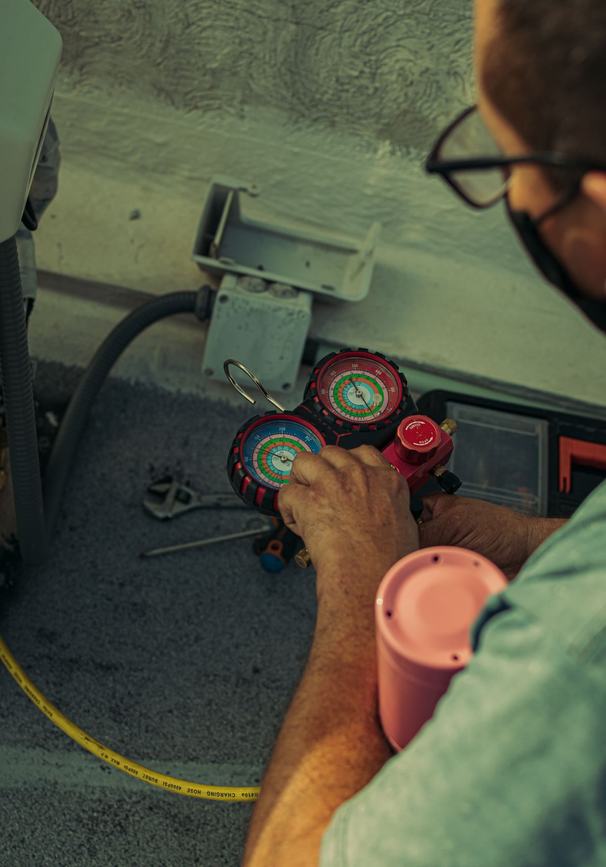 ACS Absolute Comfort technician with professional gauges in Houston TX